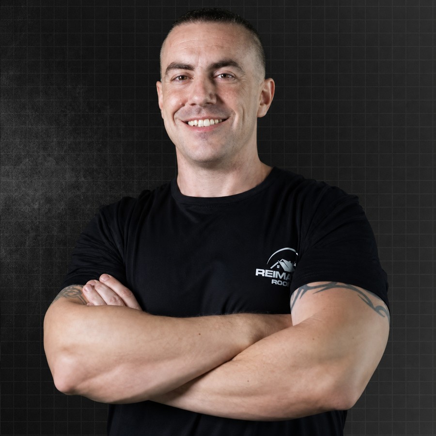 Kody Landals, founder of Reimagine Your Sales, arms crossed